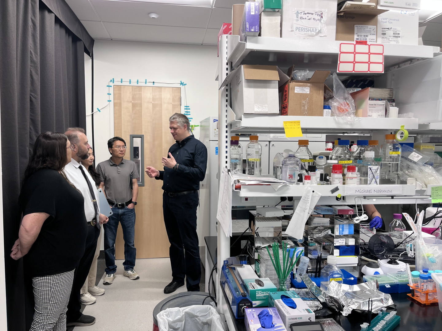Rafal Holubowicz, PhD, 2025 awardee is giving the team the tour of the new facility at Falling Leaves Foundation Medical Building